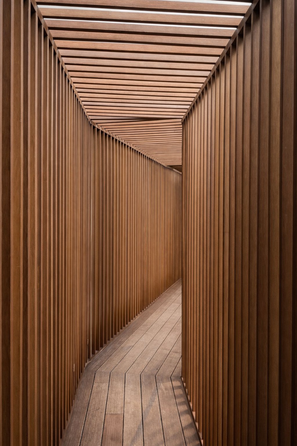 Floor-to-ceiling timber slat corridor installation Bangkok